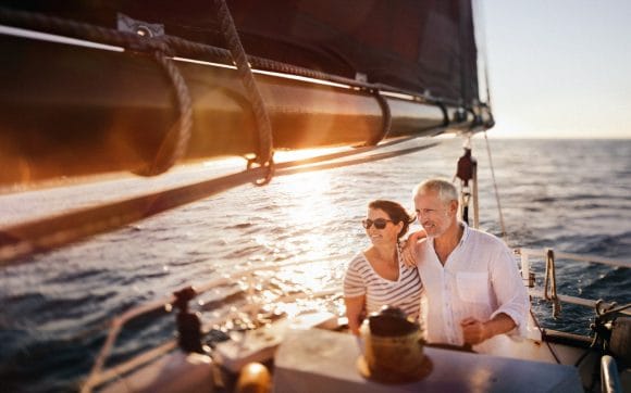 Senior couple on sailing boat